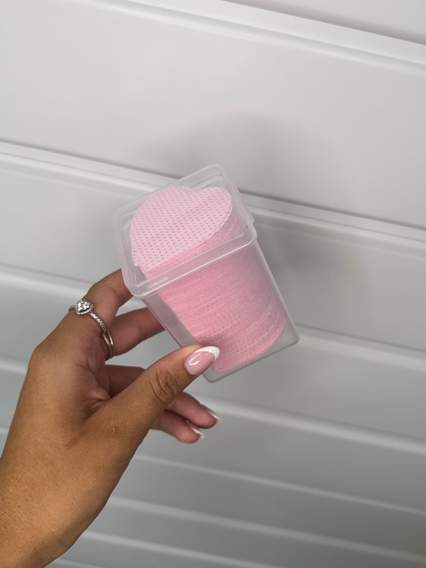 Adhesive nozzle wipes